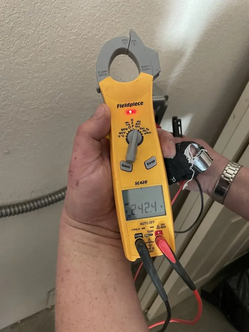 Voltage testing with clamp meter during Ceiling Fan Installation in Whitestown